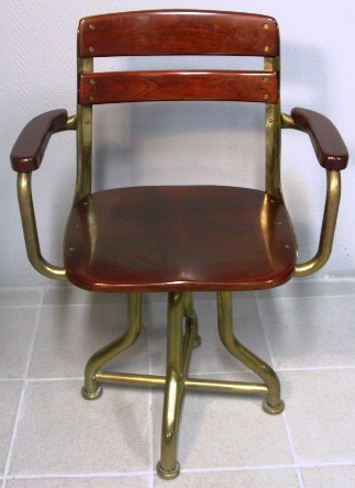 Armchair in mahogany and brass from American Seating Company. 1950's.